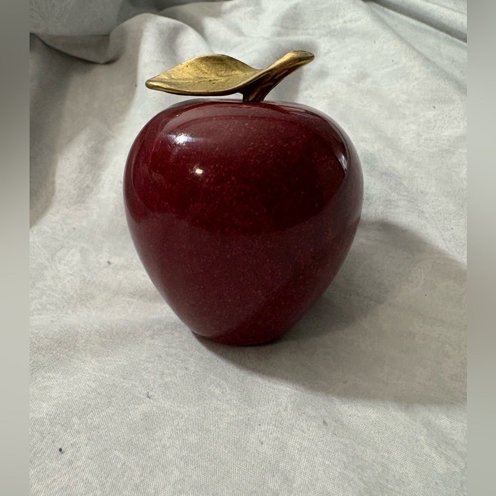 Polished red marble apple with brass leaf, EC